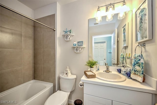 full bathroom with vanity, toilet, and tiled shower / bath combo