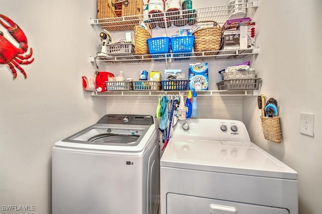 laundry room with washing machine and dryer