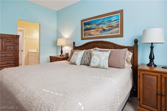 bedroom with carpet and ensuite bathroom