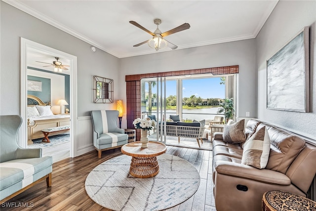 living room featuring crown molding, hardwood / wood-style floors, and ceiling fan