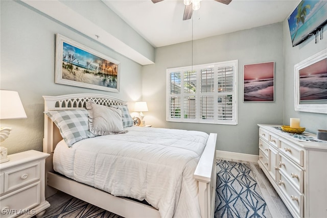 bedroom with ceiling fan and light hardwood / wood-style floors