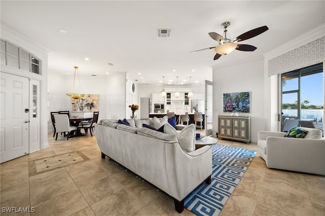 living room featuring ceiling fan and crown molding