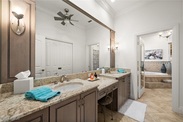 bathroom featuring tile patterned floors, tiled tub, vanity, ceiling fan with notable chandelier, and ornamental molding