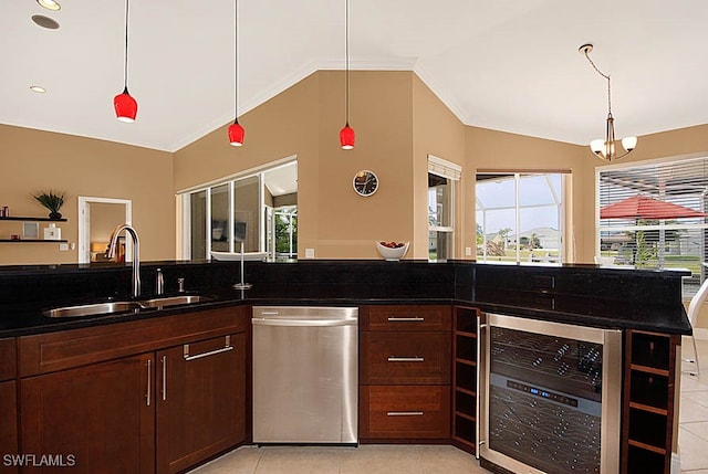 kitchen featuring stainless steel dishwasher, beverage cooler, a healthy amount of sunlight, and sink