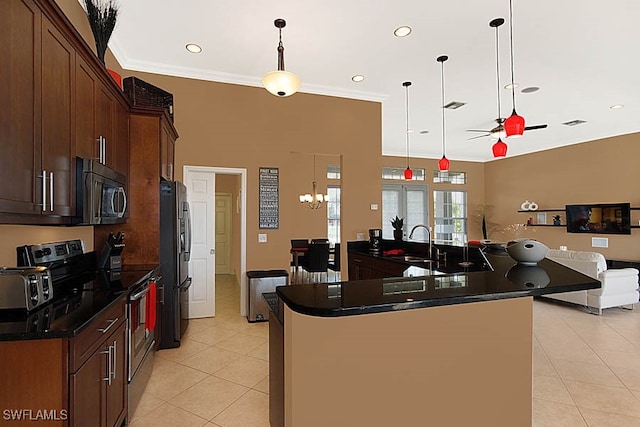 kitchen featuring sink, hanging light fixtures, crown molding, light tile patterned flooring, and appliances with stainless steel finishes