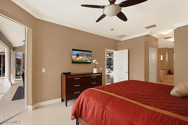 tiled bedroom featuring ceiling fan, crown molding, and ensuite bath