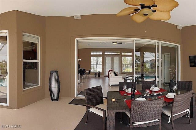 dining area featuring french doors and ceiling fan