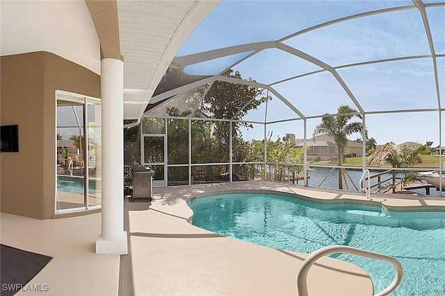 view of pool featuring a patio and glass enclosure