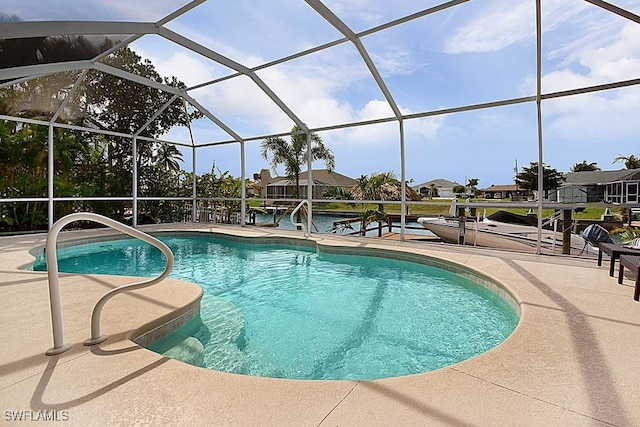 view of pool featuring a patio area and a lanai