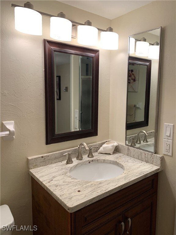 200 Periwinkle Way Unit 332, Sanibel, FL 33957 - half bath with vanity and toilet