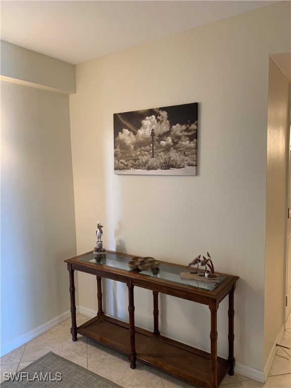 200 Periwinkle Way Unit 332, Sanibel, FL 33957 - hallway with light tile patterned floors and baseboards