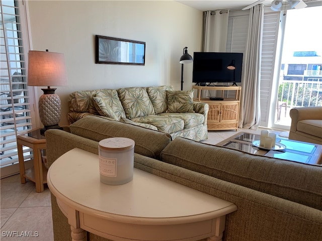 200 Periwinkle Way Unit 332, Sanibel, FL 33957 - living room with light tile patterned floors