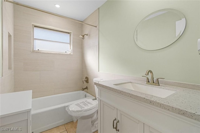 full bathroom featuring toilet, tile patterned flooring, vanity, and tiled shower / bath