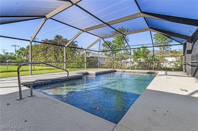 view of pool with a patio and a lanai