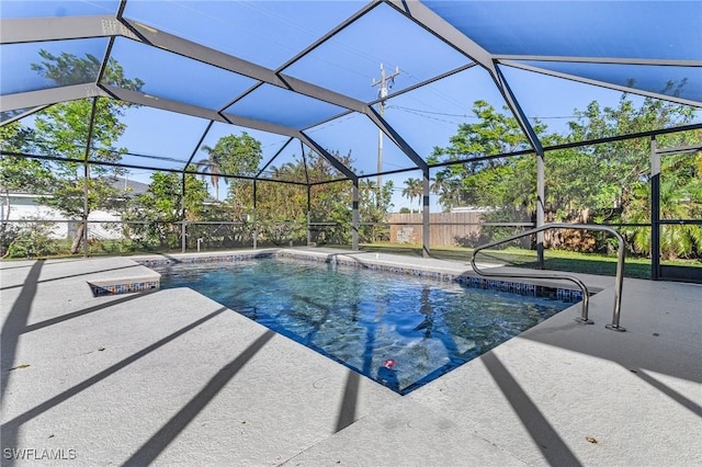 view of swimming pool featuring a lanai and a patio