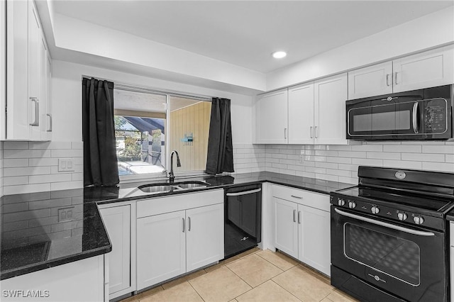 kitchen with tasteful backsplash, sink, white cabinets, and black appliances