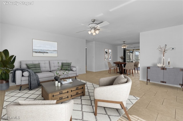 tiled living room featuring ceiling fan