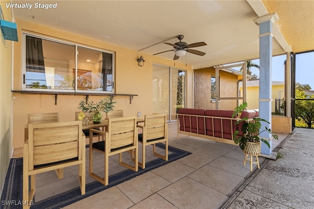 view of patio featuring ceiling fan