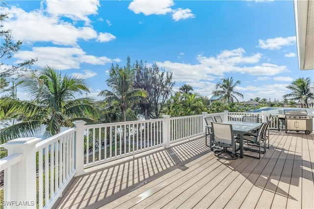 wooden deck featuring area for grilling