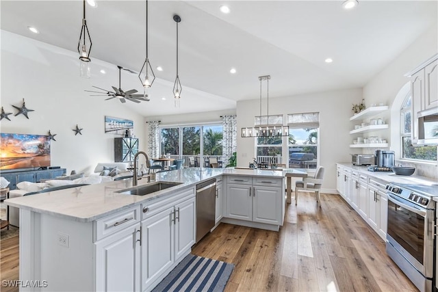 kitchen featuring a healthy amount of sunlight, white cabinetry, sink, and appliances with stainless steel finishes