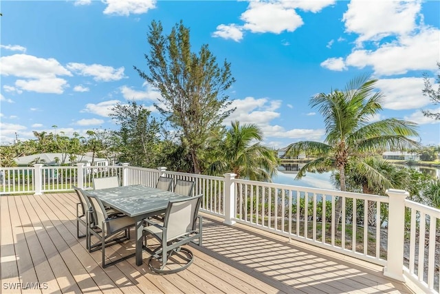 wooden deck featuring a water view