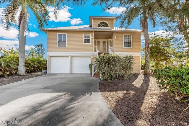 view of front of house featuring french doors and a garage