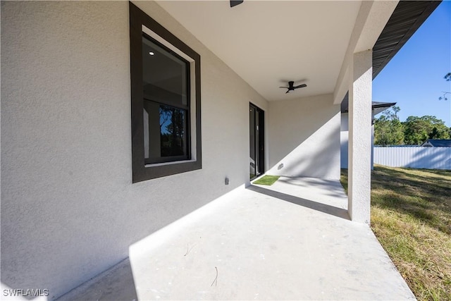 view of patio featuring ceiling fan