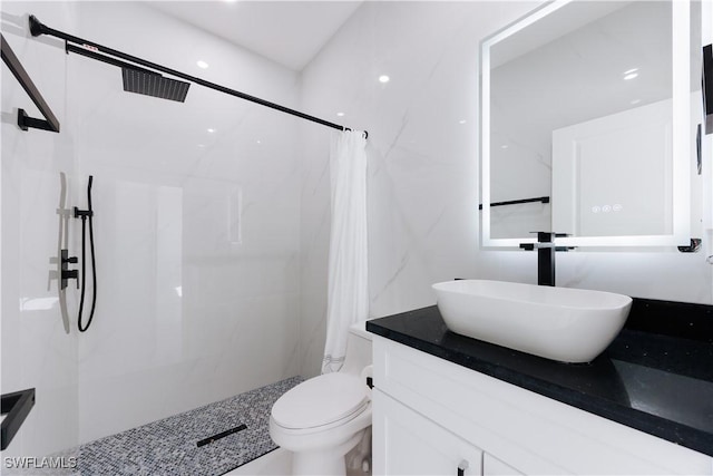 bathroom with vanity, toilet, and a shower with shower curtain