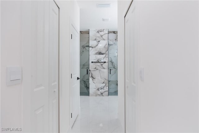 interior space featuring a tile shower