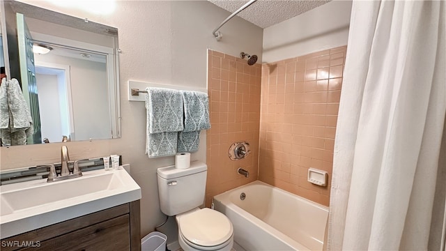 full bathroom with vanity, shower / bathtub combination with curtain, a textured ceiling, and toilet