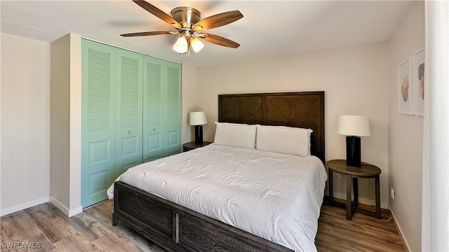 bedroom with ceiling fan, a closet, and light hardwood / wood-style floors