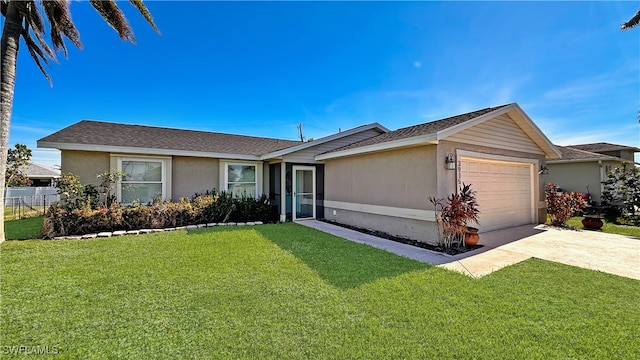 ranch-style house featuring a garage and a front lawn