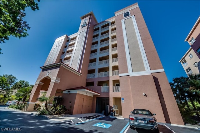 14819 Laguna Dr Unit 203, Fort Myers, FL 33908 - view of property with uncovered parking