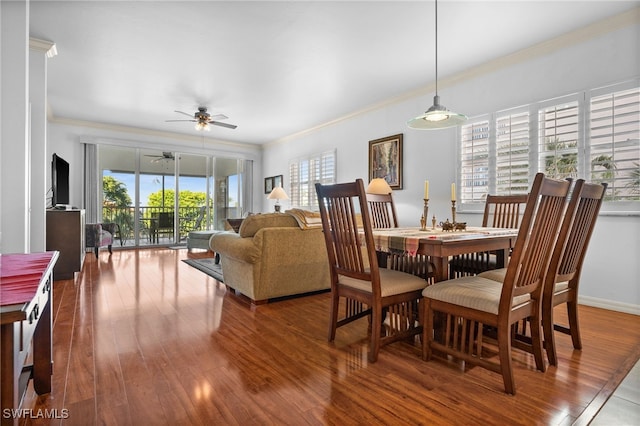 14819 Laguna Dr Unit 203, Fort Myers, FL 33908 - dining area featuring a ceiling fan, ornamental molding, baseboards, and wood finished floors