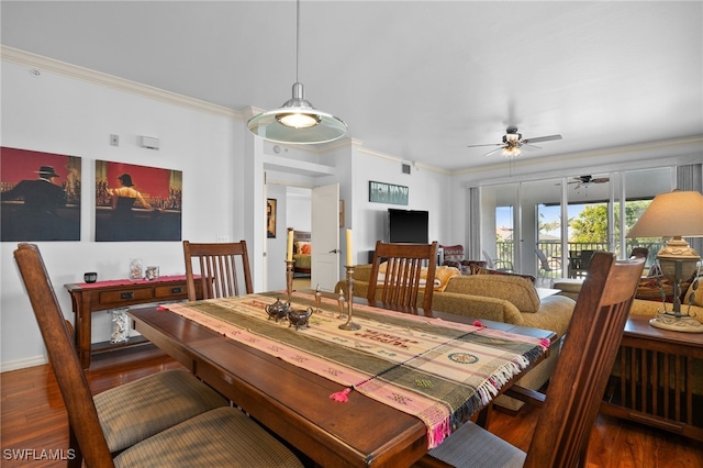 dining space with crown molding, ceiling fan, and dark hardwood / wood-style flooring