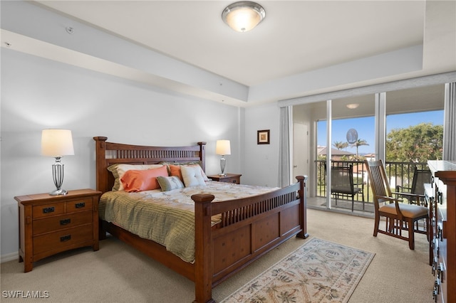 carpeted bedroom featuring access to outside