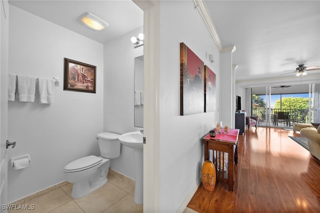 bathroom with tile patterned flooring, ceiling fan, crown molding, and toilet