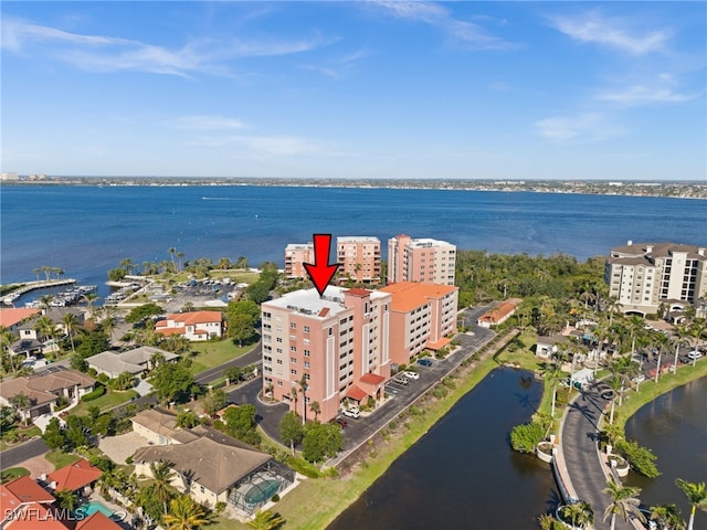 birds eye view of property with a water view