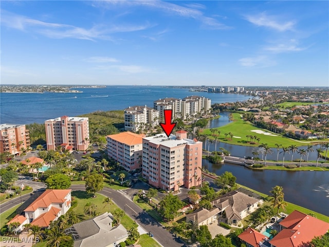 birds eye view of property with a water view