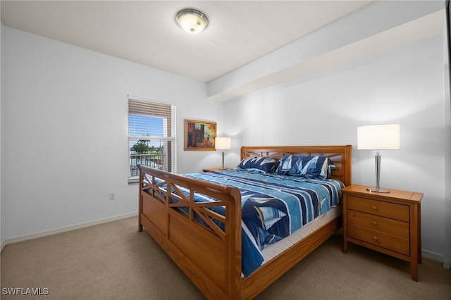 bedroom featuring light colored carpet