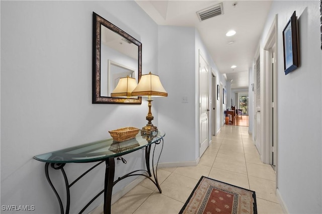 14819 Laguna Dr Unit 203, Fort Myers, FL 33908 - hall featuring baseboards, visible vents, recessed lighting, and light tile patterned floors