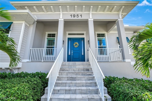 entrance to property with a porch