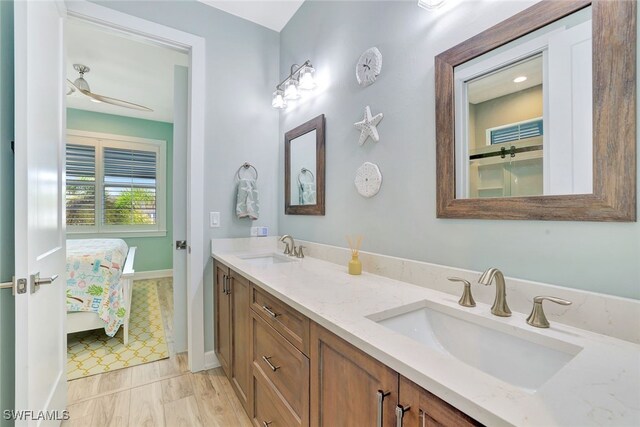 bathroom featuring vanity, tile patterned floors, and ceiling fan