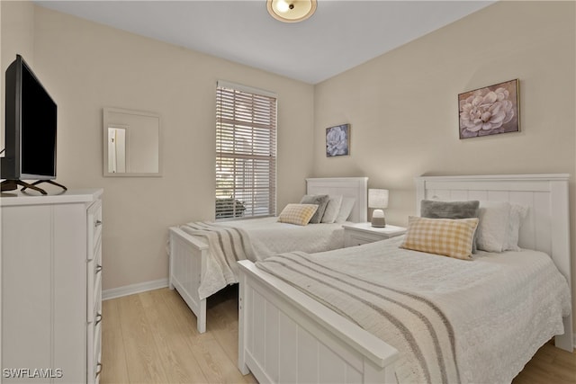 bedroom with light wood-type flooring