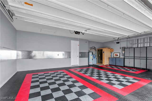 garage featuring water heater and a garage door opener