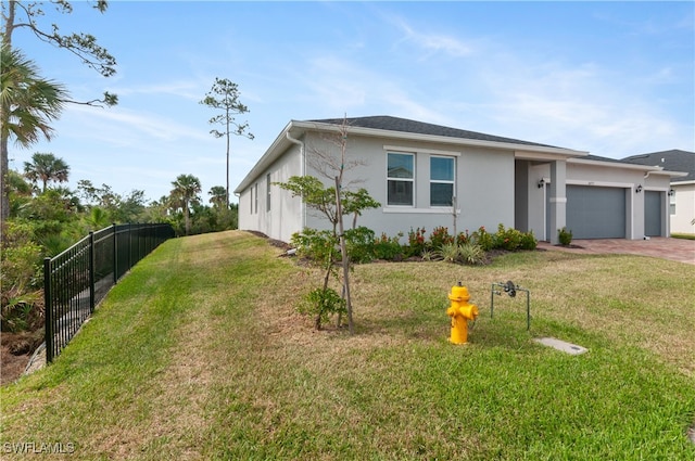 ranch-style house featuring a garage and a front yard