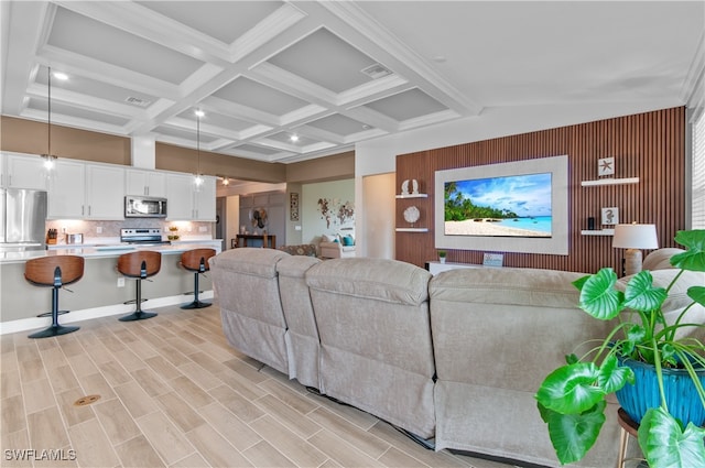 living room featuring coffered ceiling, beam ceiling, and light hardwood / wood-style flooring