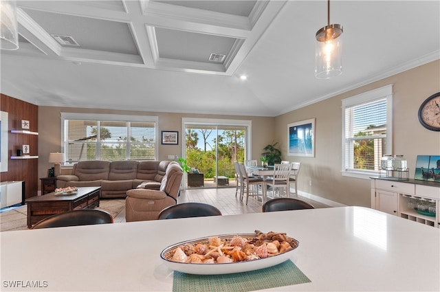 dining room with beam ceiling, plenty of natural light, coffered ceiling, and ornamental molding