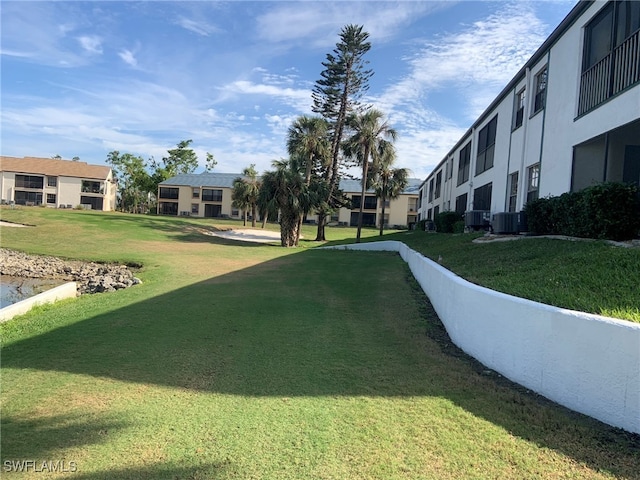 view of property's community with a lawn