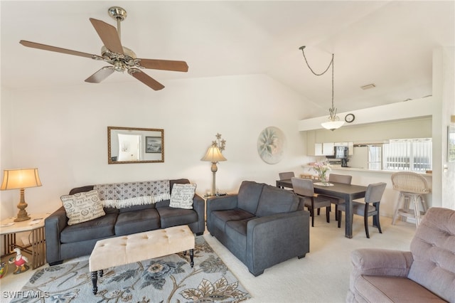 living room with light carpet, ceiling fan, and lofted ceiling